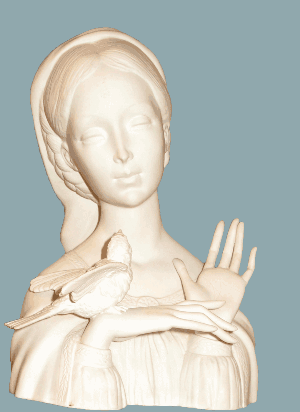 Antique statue of woman and bird